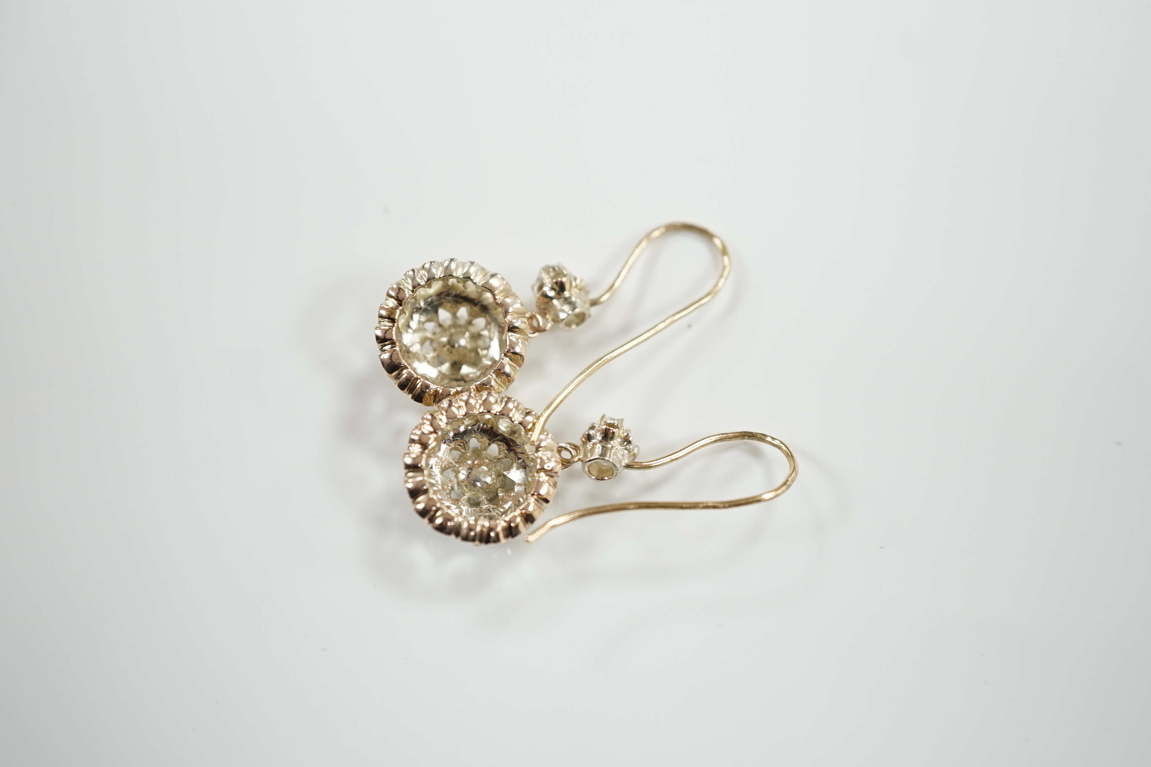 A pair of antique style yellow metal and rose cut diamond cluster set drop earrings, 24mm, gross weight 6.6 grams (stones missing).